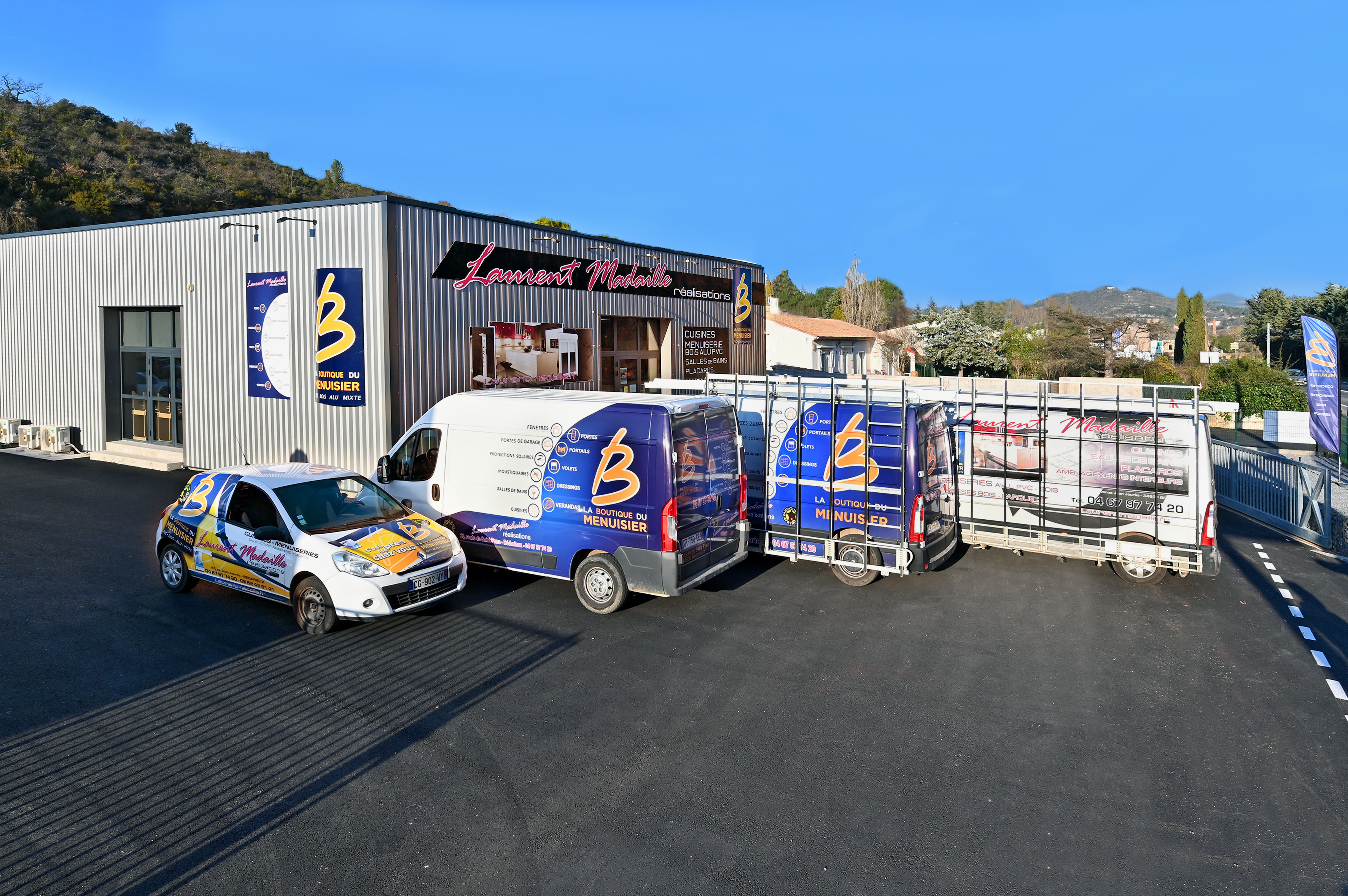Façade et véhicules Boutique Laurent Madaille Réalisations à Bédarieux